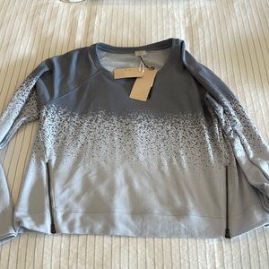 Calia Sweatshirt with side zippers.